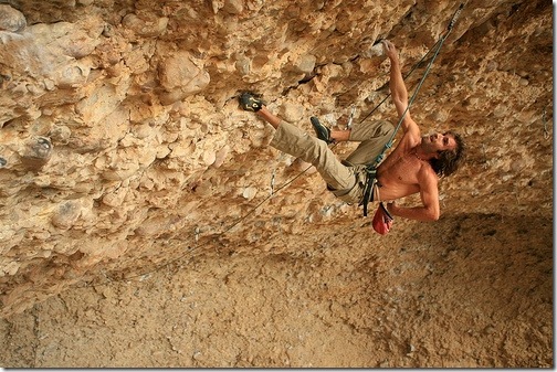 Sharma pulling down in the Pipe Dream Cave